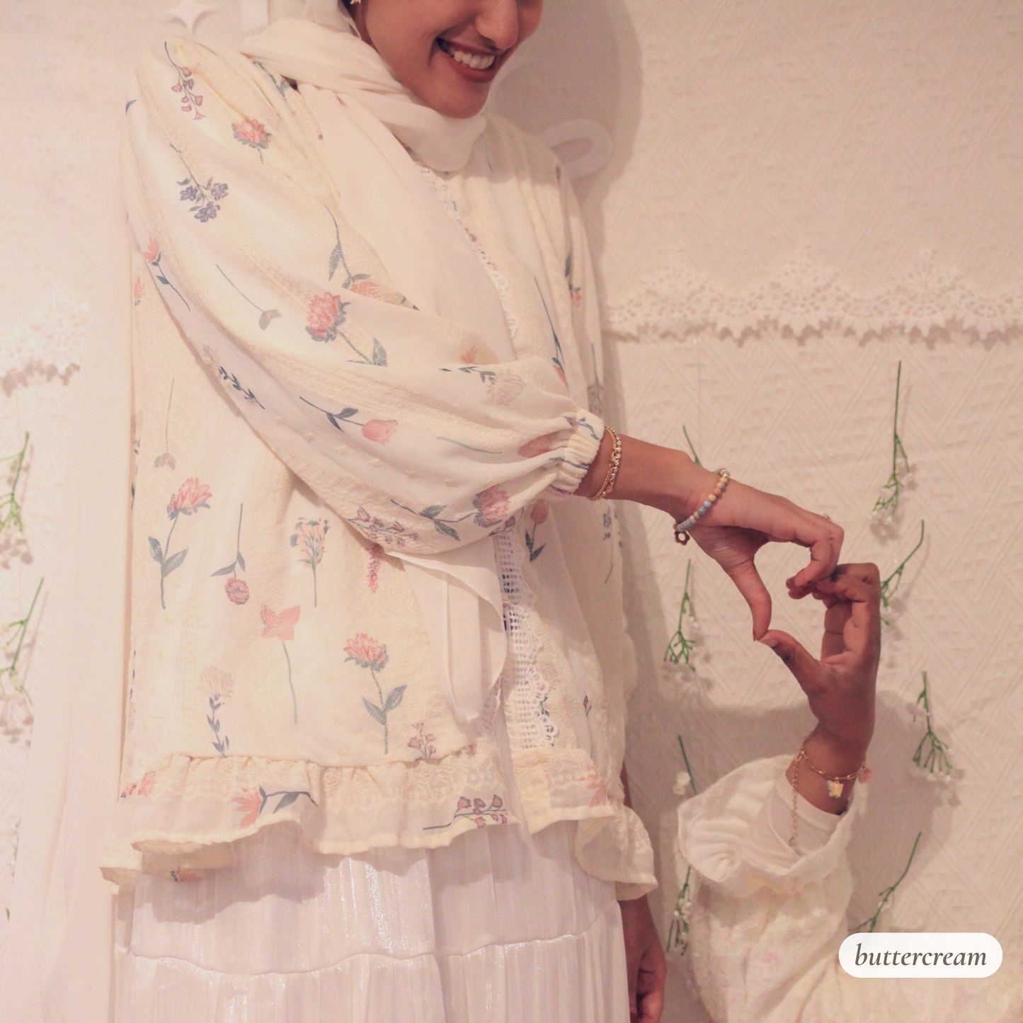 Close-up of Rosemary Verse blouse showing soft floral textured fabric and delicate lace detailing representing growth, femininity, and modest elegance