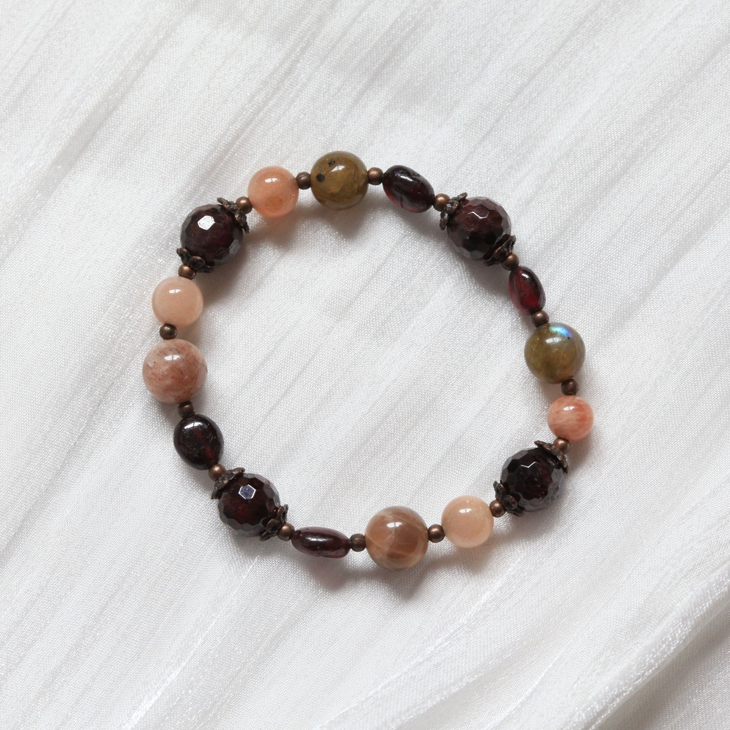 Vintage Aura Bracelet with deep red and earthy brown tones inspired by vintage aesthetics, symbolising calm, wisdom, and reflection. Made by Dreamers' Side