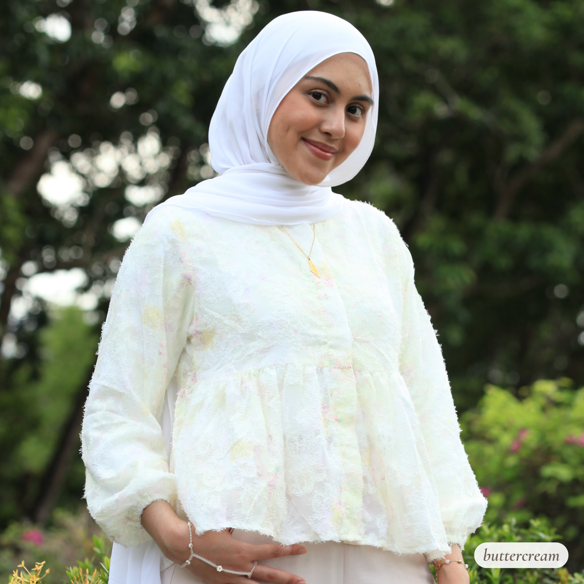 Hijabi model wearing Willow Waltz blouse, a modest ethereal babydoll top with soft vintage-inspired silhouette and elegant drape