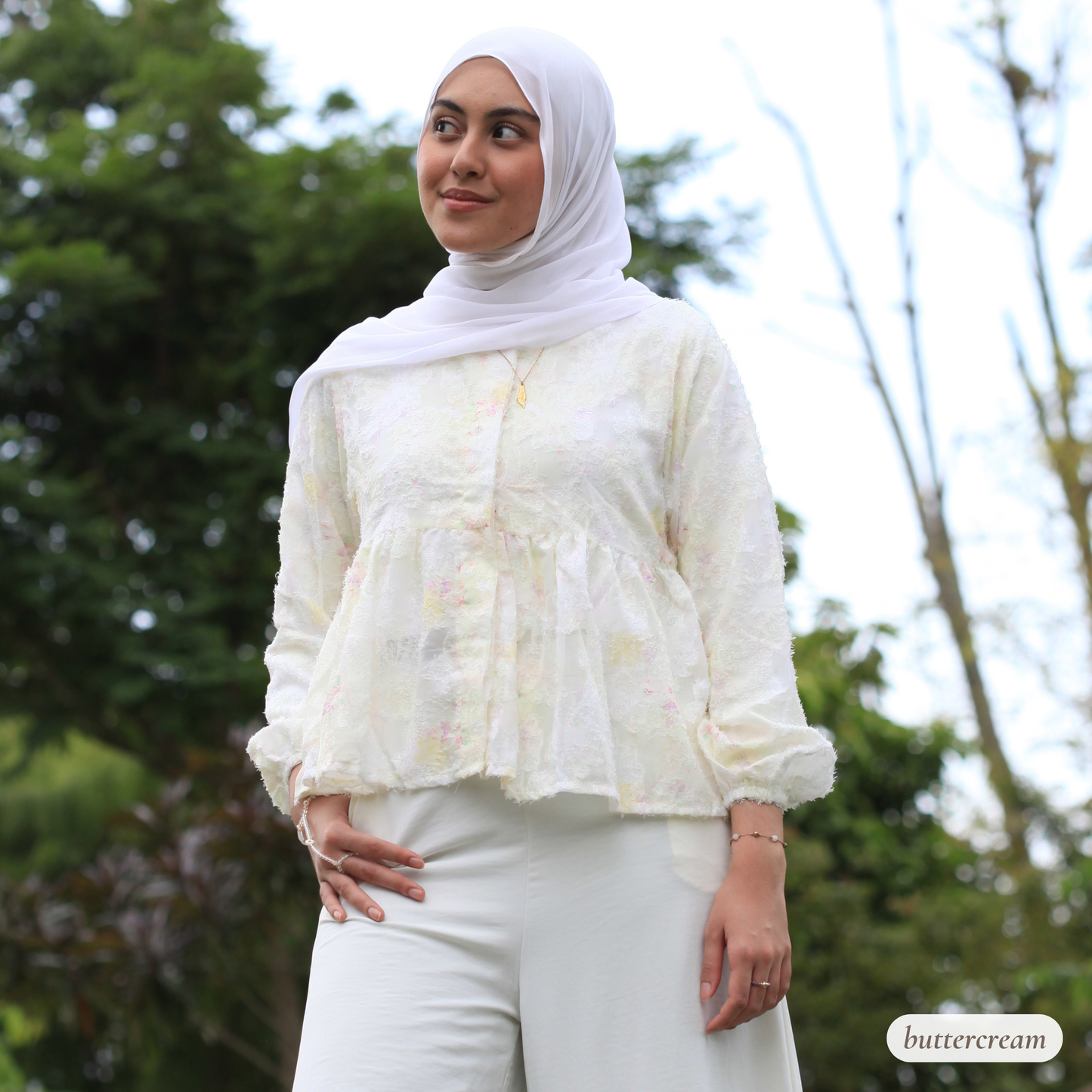 Hijabi model wearing Willow Waltz blouse, a modest ethereal babydoll top with soft vintage-inspired silhouette and elegant drape