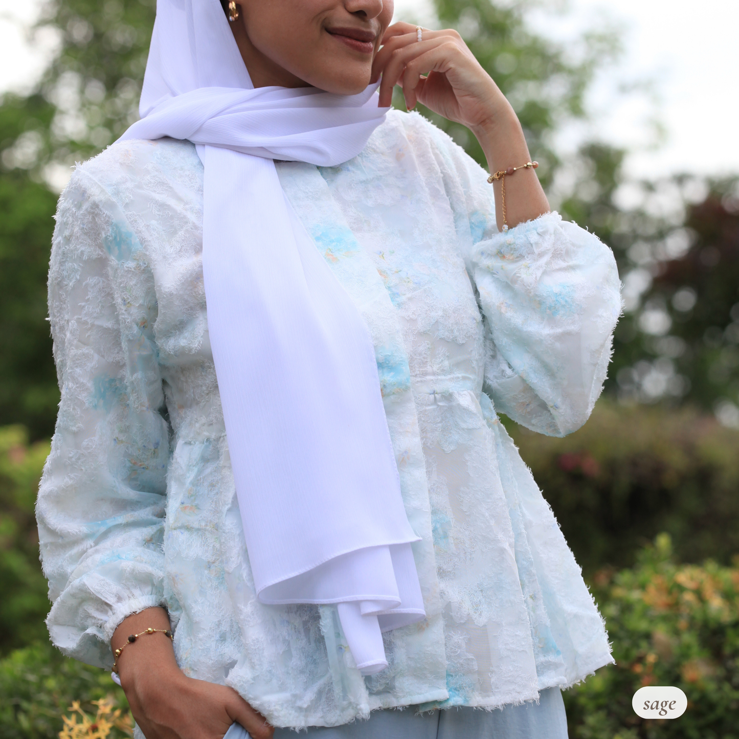 Close-up of Willow Waltz blouse fabric showing soft jacquard-like texture, breathable lightweight material, and subtle sheen with dreamy ombré colour transition for modest hijabi clothing