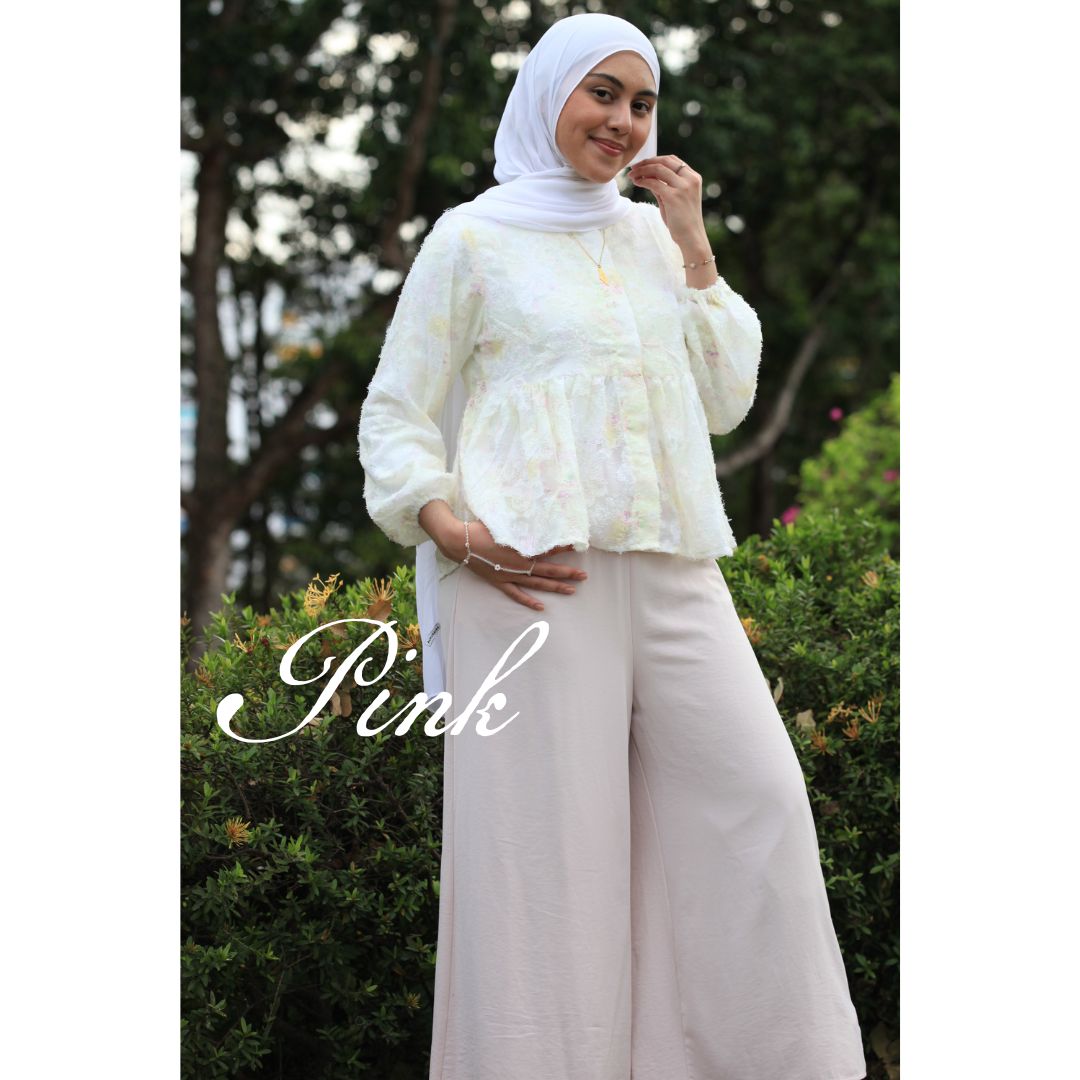 Hijabi model wearing Ariana Palazzo Pants in pink colour, featuring a flowy modest wide-leg silhouette with elegant movement