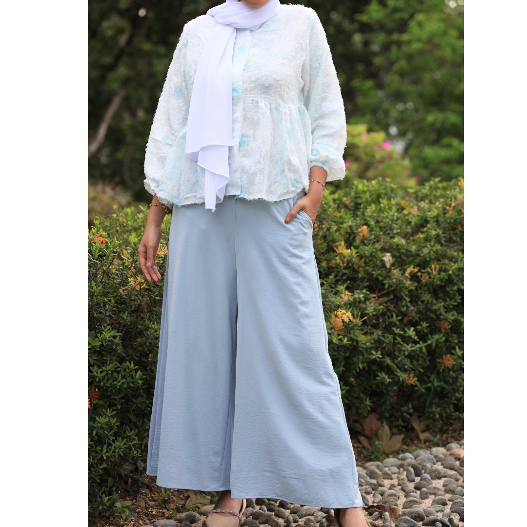 Hijabi model wearing Ariana Palazzo Pants in Sky colour, featuring a flowy modest wide-leg silhouette with elegant movement
