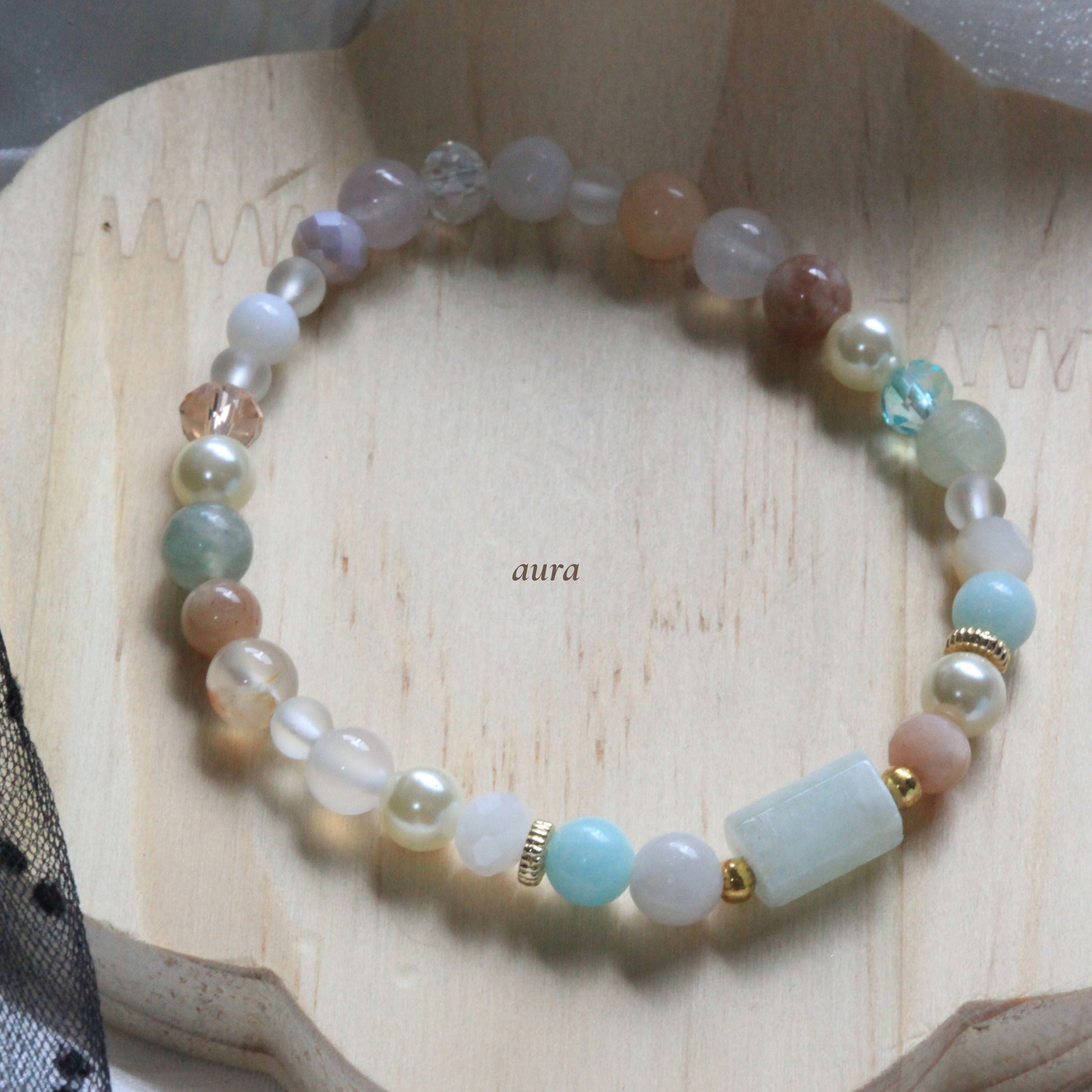 Dreamtide bracelet in Mist pink, Aura blue, and Eclipse Dew teal pastel shades with natural stones and delicate bead details