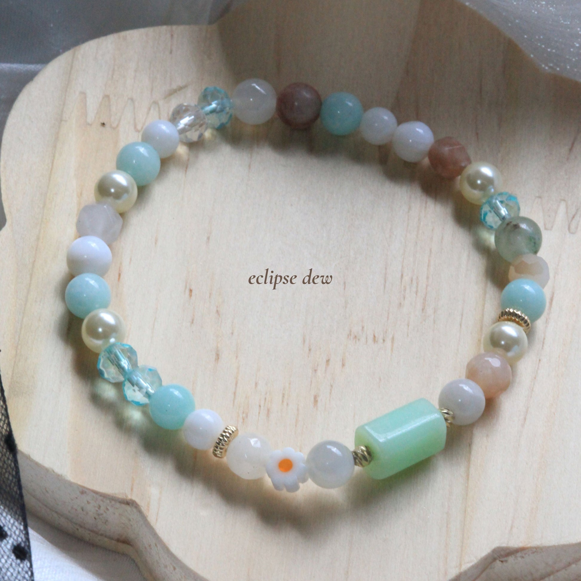 Dreamtide bracelet in Mist pink, Aura blue, and Eclipse Dew teal pastel shades with natural stones and delicate bead details