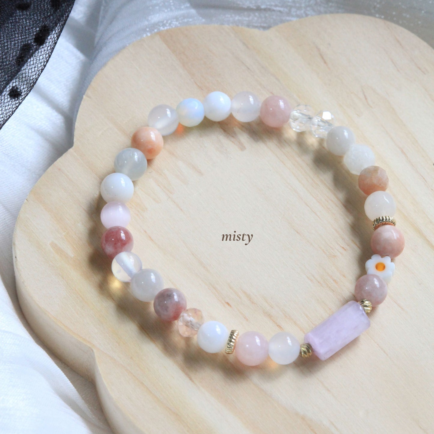 Dreamtide bracelet in Mist pink, Aura blue, and Eclipse Dew teal pastel shades with natural stones and delicate bead details