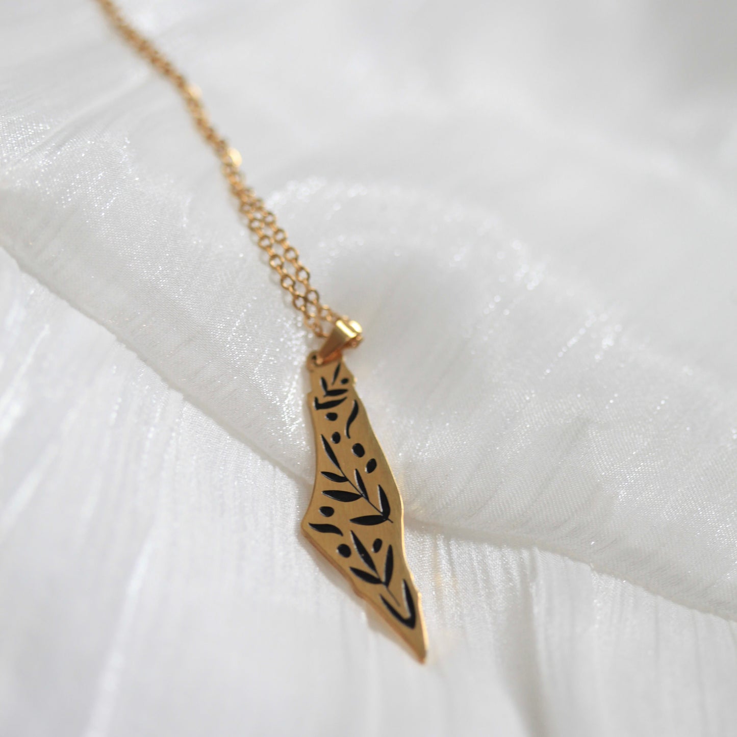Necklace in the shape of Falasteen with olive branches pattern.