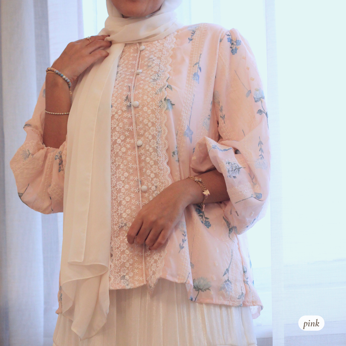 Close-up of Rosemary Verse blouse showing soft floral textured fabric and delicate lace detailing representing growth, femininity, and modest elegance