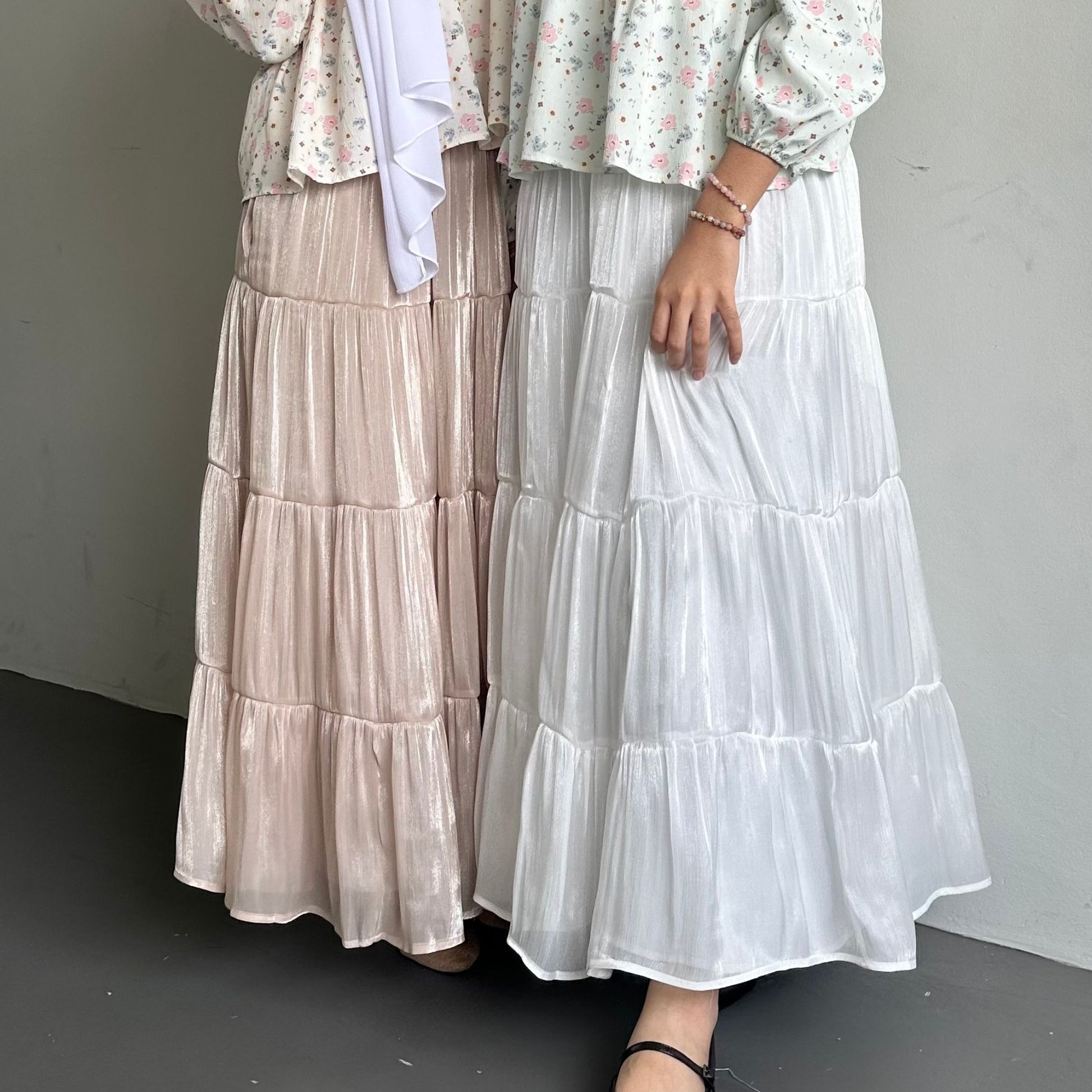 Hijabi model wearing Scintilla Skirt , a modest flowy skirt with elegant movement and soft shimmering finish