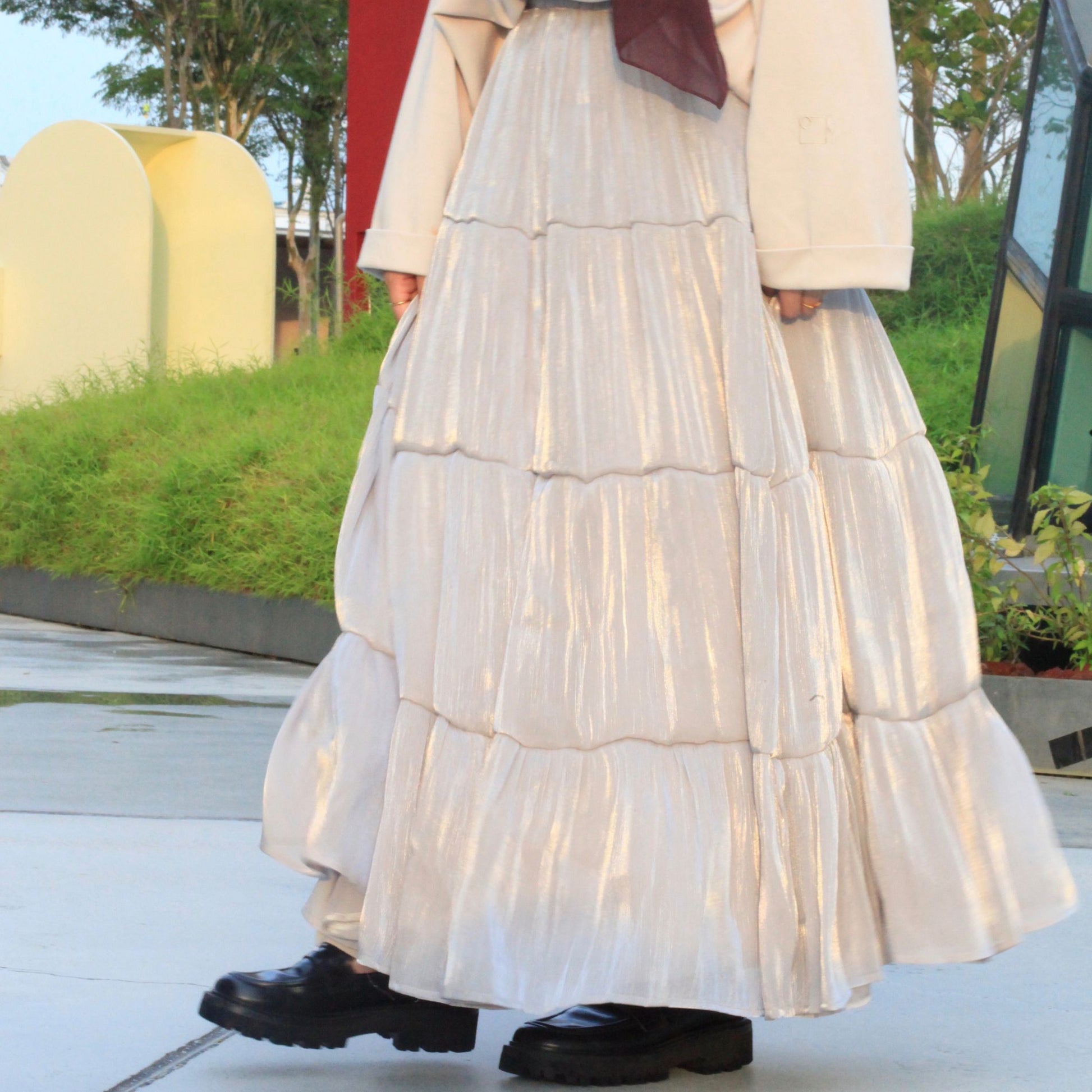 Hijabi model wearing Scintilla Skirt, a modest flowy skirt with elegant movement and soft shimmering finish