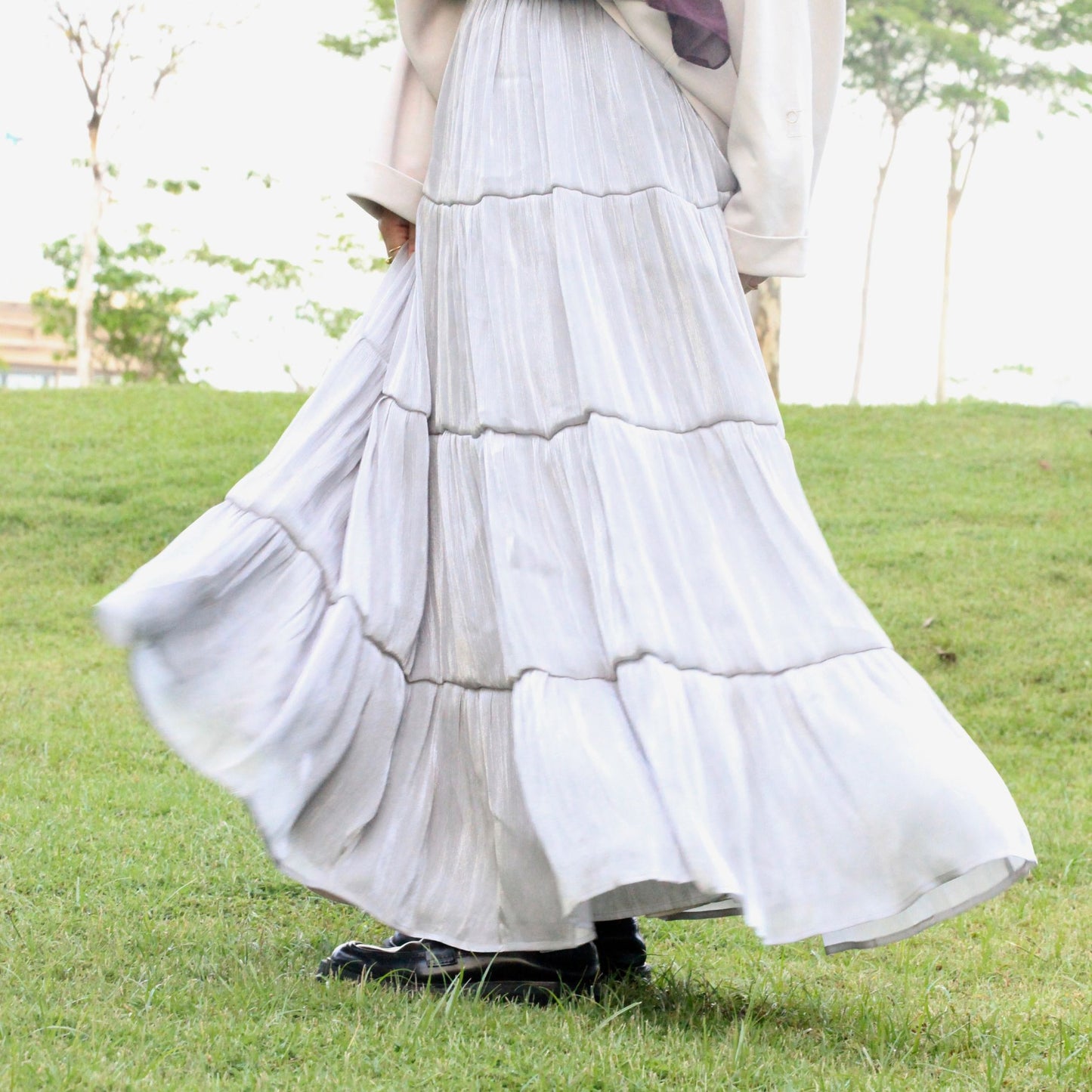 Hijabi model wearing Scintilla Skirt in Silver Haze, a modest flowy skirt with elegant movement and soft shimmering finish