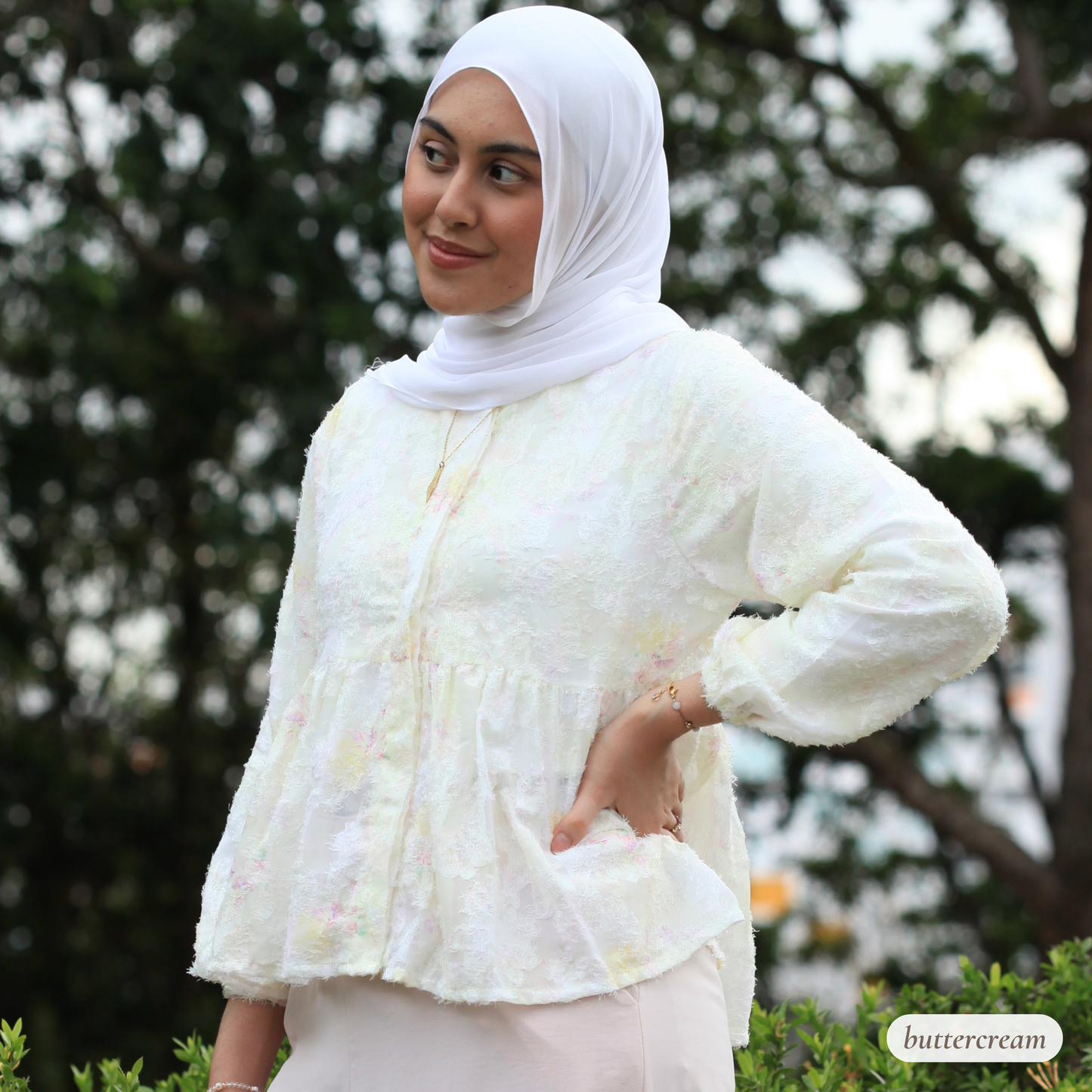 Hijabi model wearing Willow Waltz blouse, a modest ethereal babydoll top with soft vintage-inspired silhouette and elegant drape