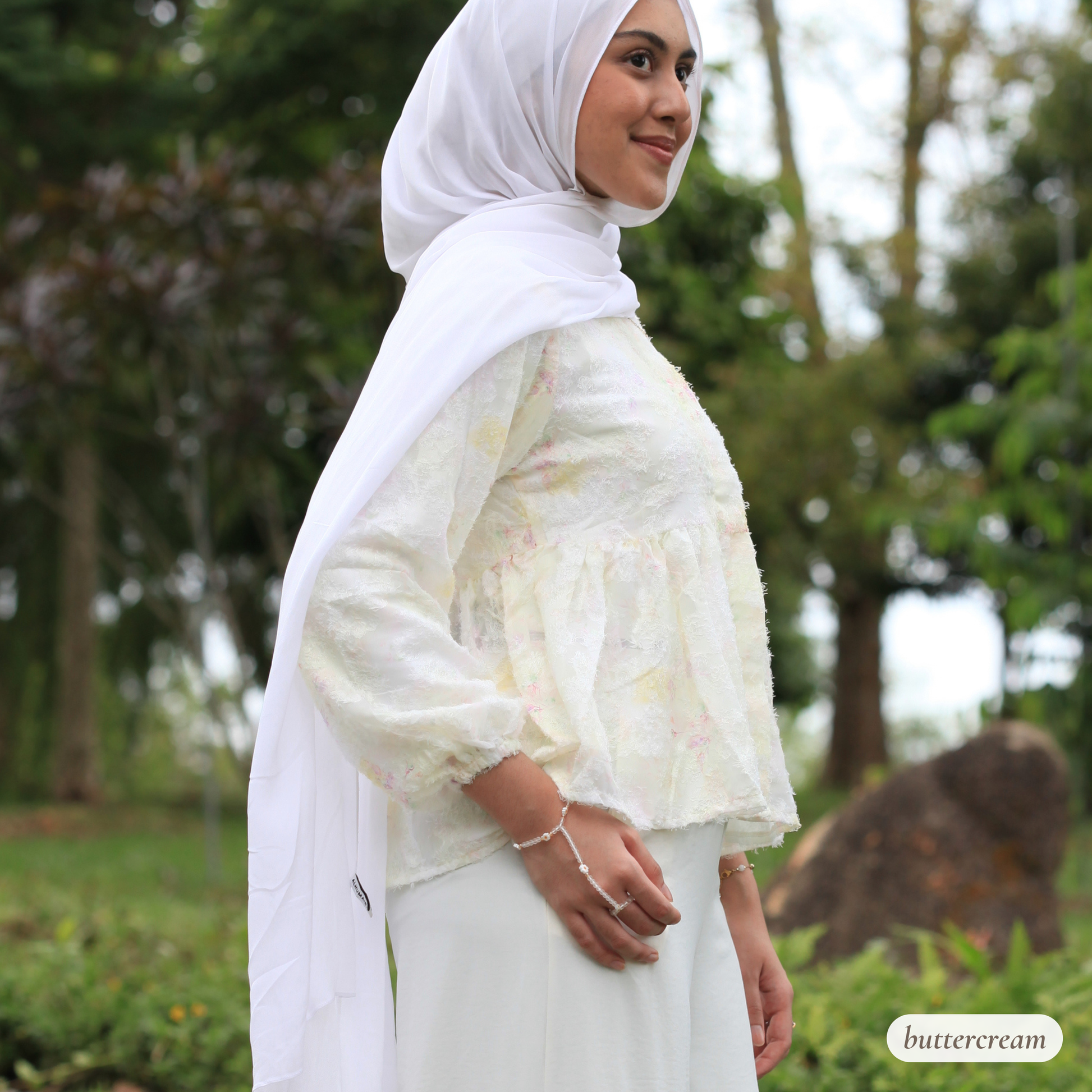 Hijabi model wearing Willow Waltz blouse, a modest ethereal babydoll top with soft vintage-inspired silhouette and elegant drape